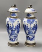 A pair of early 20th century Chinese blue and white crackle glaze vases and covers, 30cm