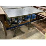 A pair of zinc top cafe tables with cast iron underframes, 60 x 60cm