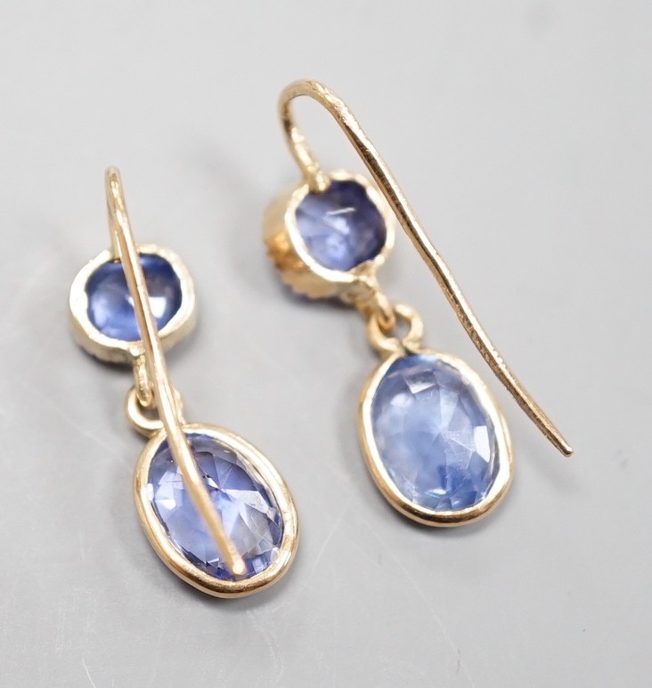 A pair of 14k yellow metal and two stone sapphire set drop earrings, 23mm, gross weight 2.4 grams. - Image 2 of 2