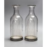 A pair of French glass carafes with silver plated bases and integral ice compartment 28cm