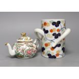 A Chinese Canton decorated famille rose teapot and a Japanese Fukugawa three handled vase (2),