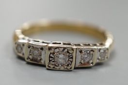 A yellow metal and graduated illusion set five stone diamond half hoop ring, size M/N, gross