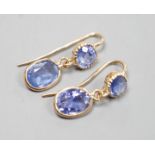 A pair of 14k yellow metal and two stone sapphire set drop earrings, 23mm, gross weight 2.4 grams.