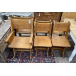 A set of six Gothic style oak dining chairs including a pair of carvers