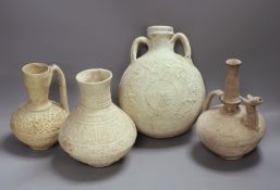 A group of Islamic terracotta vessels, Middle Eastern, possibly 12th century, including two jugs, an