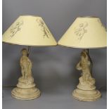 A pair painted composition cherub lamps on plinth base, altogether 43cm tall