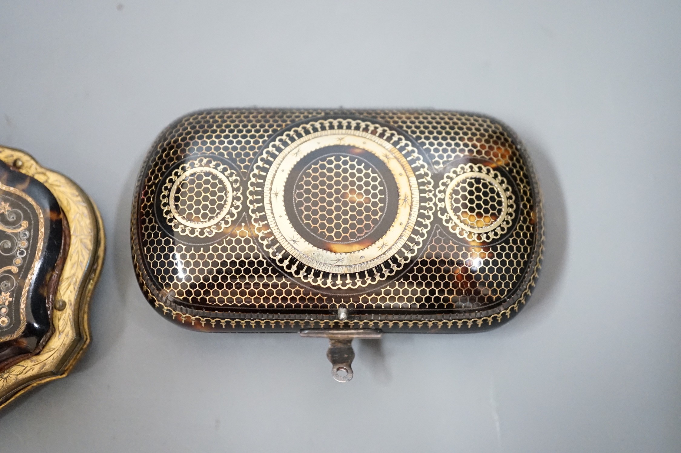 A 19th century finely worked tortoiseshell piqué work purse, with blue silk lining and a similar git - Image 3 of 5