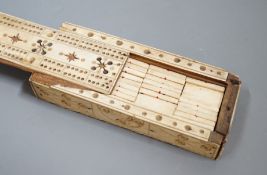 A Napoleonic Prisoner of War bone domino set, box 14cm wide
