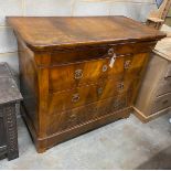 A French Second Empire figured walnut commode, fitted with four long guilt metal mounted drawers,