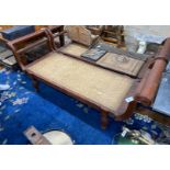An Asian hardwood day bed with caned seat, width 212cm depth 71cm