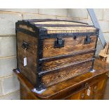 A metal bound domed top steamer trunk, 57 cm high, 76 cm wide, 49 cm