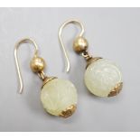 A pair of antique gilt metal and carved hardstone spherical drop earrings, jade diameter 14mm.