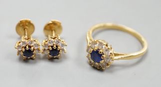A modern 18ct gold, sapphire and diamond set circular cluster ring, size L and a pair of matching
