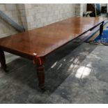 A large Edwardian walnut extending dining table with four leaves, extends to 358 x 138cm, height