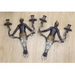 A pair of Blackamoor two branch wall lights, 53cm tall