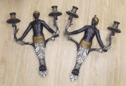 A pair of Blackamoor two branch wall lights, 53cm tall