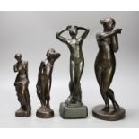 A group of four bronze finished statuettes, tallest 32cm