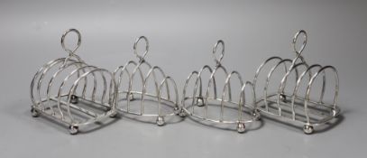 Two pairs of Edwardian silver five bar toast racks, including arched by Elikington & Co, Birmingham,