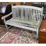 A weathered teak garden bench, width 120cm