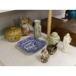A collection of mostly Chinese ceramics, to include a vase, a lion dog, pestle and mortar etc.