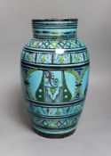 A large Persian ovoid painted terracotta vase, 34cm
