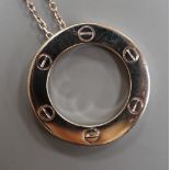 A modern Italian Cartier 750 white metal 'Love' circular pendant, 24mm, numbered CRD612779, on a 750