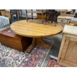 A 'Woodpecker Man' adzed oak dining table, with oval top and chip carved underframe, 170cm x 146cm