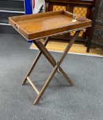 A Victorian oak butler’s tray and stand, 79.5 cm high on the stand, length 62cm, width 43cm