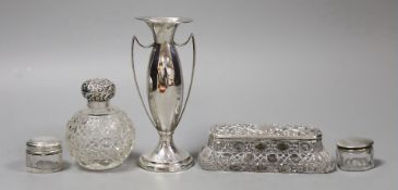 An Edwardian silver two handled posy vase, 13.7cm, a silver mounted glass scent bottle and three