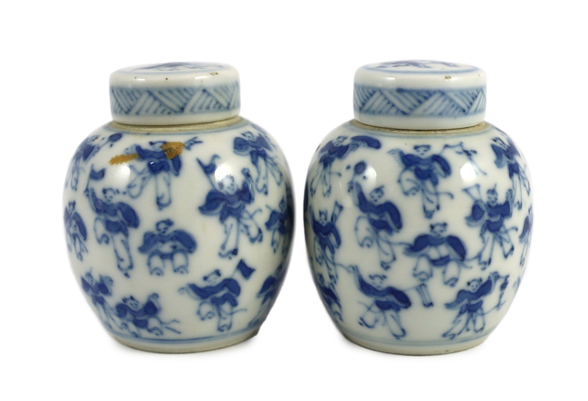 A pair of 19th century Chinese blue and white boys miniature jars and covers, 5.5 cm high
