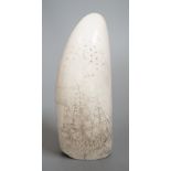 A 19th century scrimshaw sperm whale tooth, 13cm high