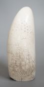 A 19th century scrimshaw sperm whale tooth, 13cm high