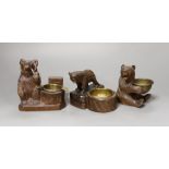 Three Black Forest ‘bear’ match-holders, tallest 11cm