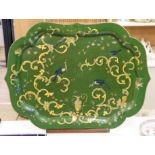 A green lacquered Papier mache tray with ornate gilding style decoration, with associated hardwood