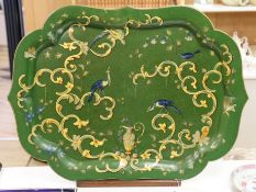 A green lacquered Papier mache tray with ornate gilding style decoration, with associated hardwood