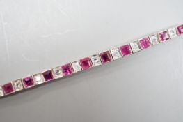 A white metal, ruby and white spinel? set line bracelet, 16cm, gross weight 8.4 grams.