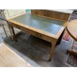 An early 20th century oak writing table, width 137cm