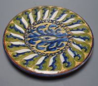 A Carlo Manzoni terracotta dish, sgraffito mark, 27cms diameter