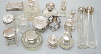 A collection of twelve assorted silver mounted glass toilet jars including Victorian, a plate