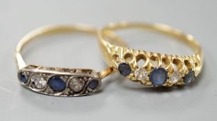 Two early 20th century yellow metal, sapphire and diamond set half hoop rings, sizes P & T, gross