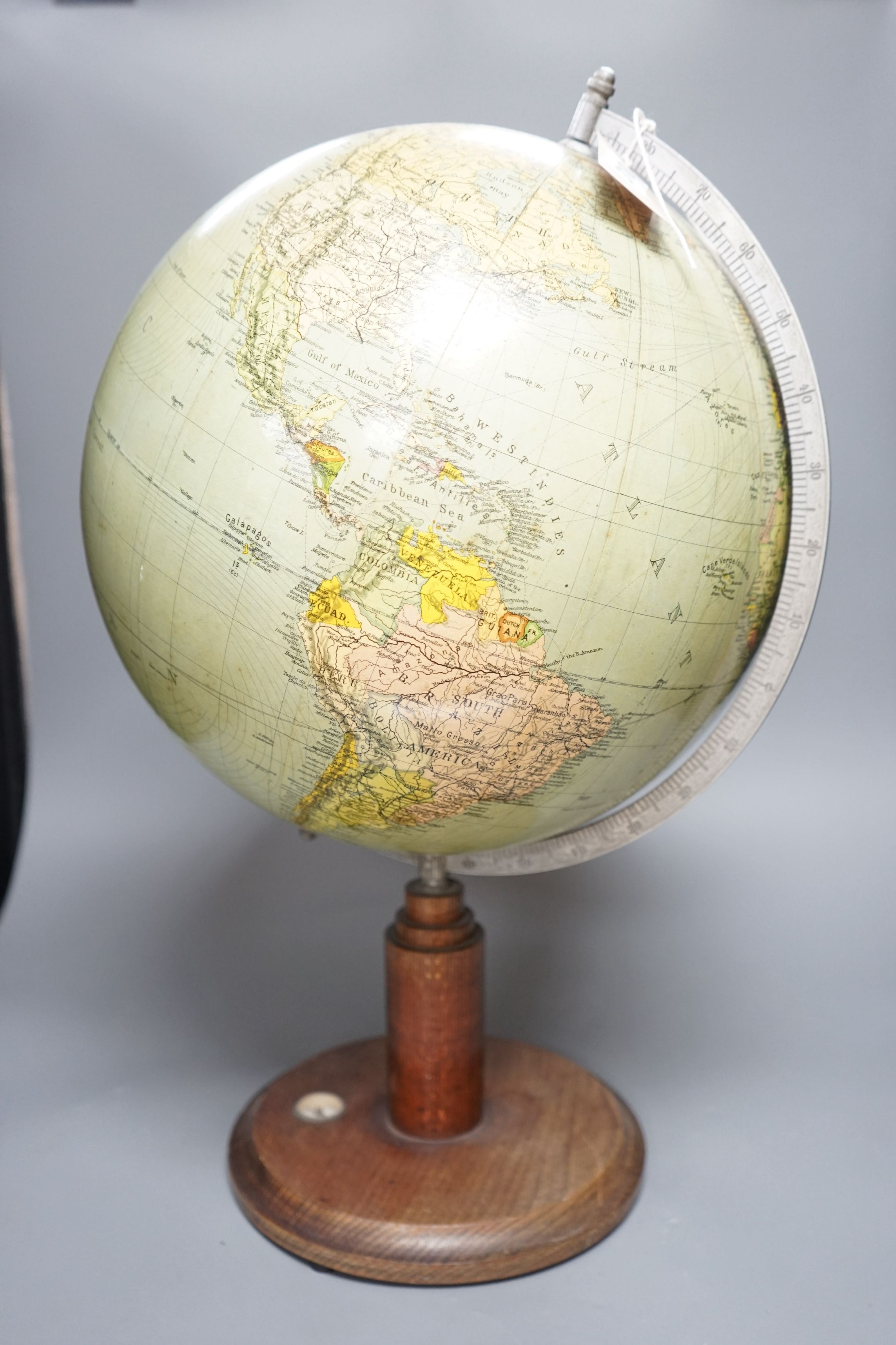 A mid 20th century globe on a revolving stand with an inset compass, 54cms high including stand - Image 3 of 3