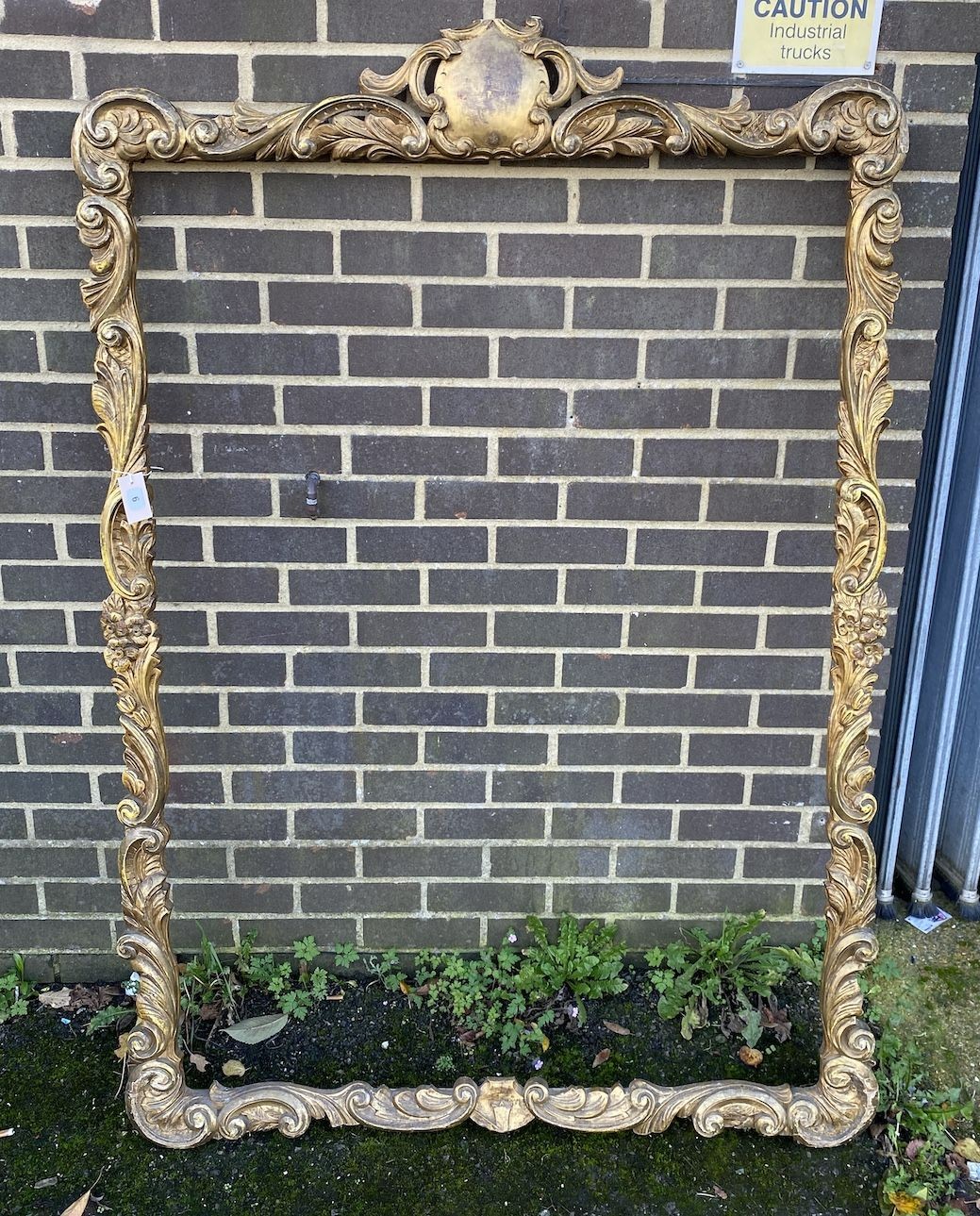 A late 19th century rectangular carved giltwood and composition picture frame, width 115cm, height