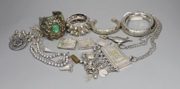 A small group of Middle Eastern mainly white metal jewellery, including bangles, bracelets and an