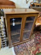 An early 20th century glazed mahogany two door bookcase, width 79cm, depth 33cm, height 109cm