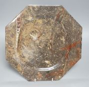 A fossil stone plate, 30cms wide