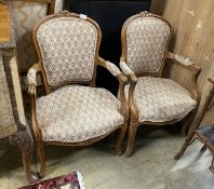 A pair of Louis XV style beech fauteuil, with a tapestry upholstered seat and back, width 55cm,