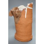 Peter Smith, a thrown terracotta cylindrical vessel with white glaze to the interior and brown