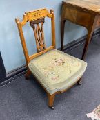 An Edwardian inlaid satinwood tub framed chair and a similar low seat chair