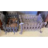Two wrought iron fire grates, larger width 47cm and a cast metal two branch wall light