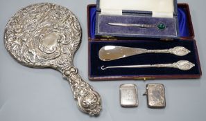 A group of small silver to include two vesta cases, a hand mirror, paste pin and a cased button hook